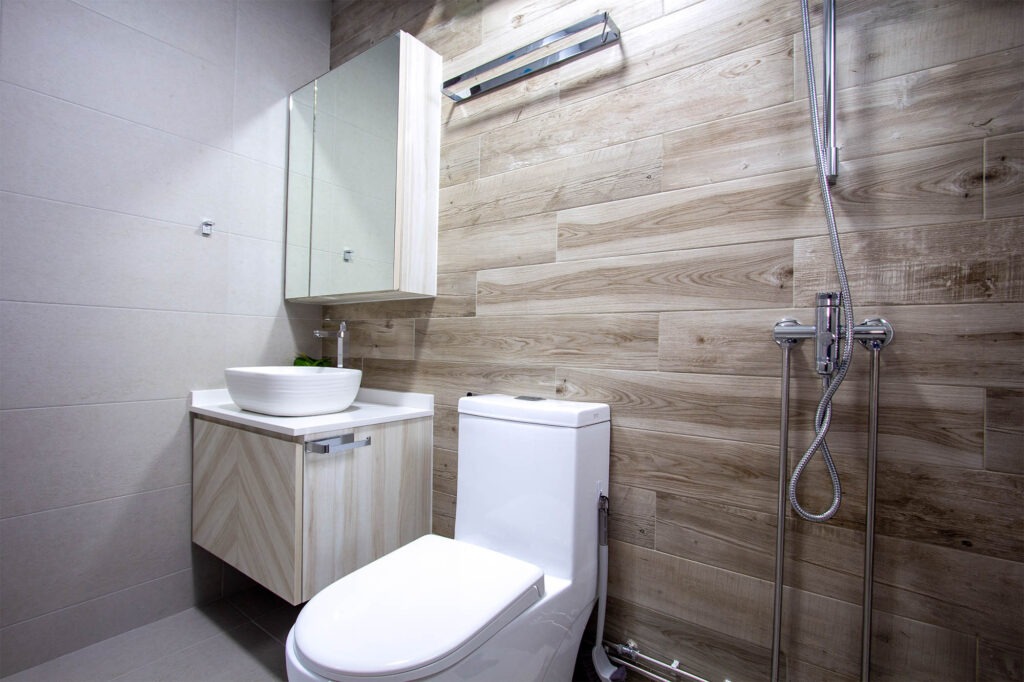 Light wooden themed common bathroom